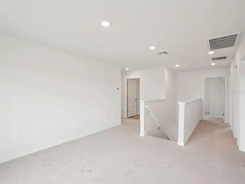 Spacious, unfurnished interior of a new home in Magnolia Bay - Classic Series, Nokomis (Image 14).