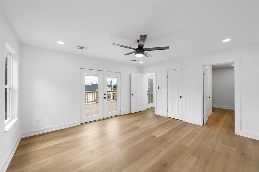 Unfurnished bedroom featuring french doors, access to exterior, light wood-style flooring, recessed lighting, and a ceiling fan Unfurnished bedroom featuring french doors, access to exterior, light wood-style flooring, recessed lighting, and a ceiling fan