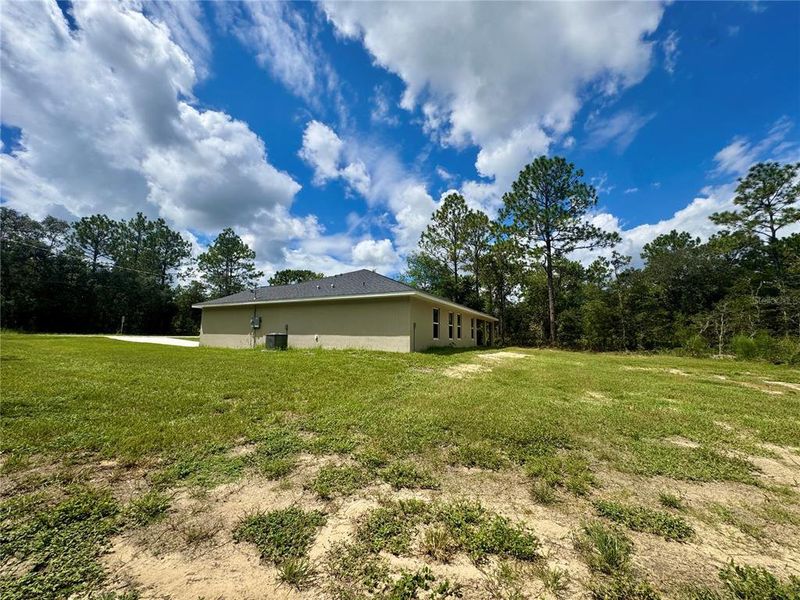 Front exterior of a new home in , Dunnellon, FL, highlighting curb appeal (Image 25).