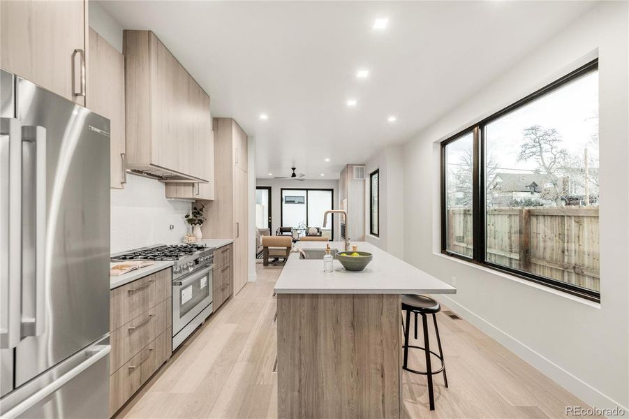 Dining is open to the kitchen and through to the backyard.