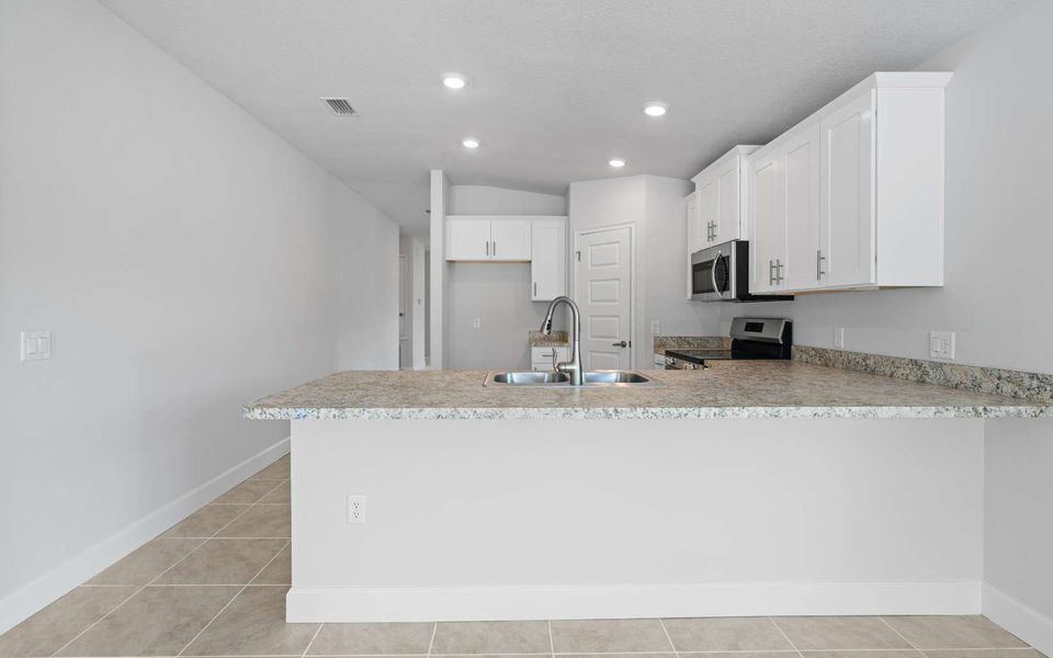 Furnished interior in a model home at Rolling Hills in Bell (Image 10).