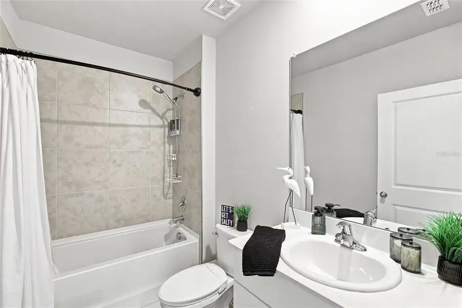 Furnished interior view inside a new home in Central Parc, North Port (Image 27). Furnished interior view inside a new home in Central Parc, North Port (Image 27).