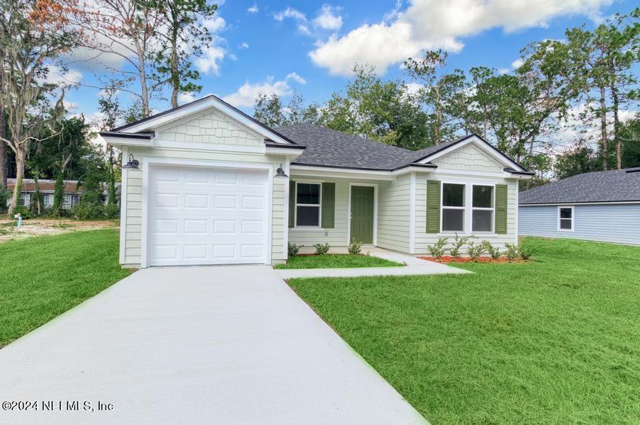 Front exterior of a new home in , Satsuma, FL, highlighting curb appeal (Image 1).