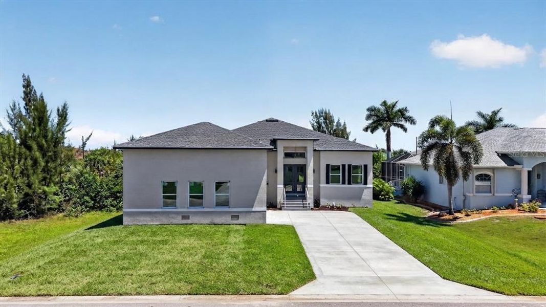 Front exterior of a new home in , Port Charlotte, FL, highlighting curb appeal (Image 25).