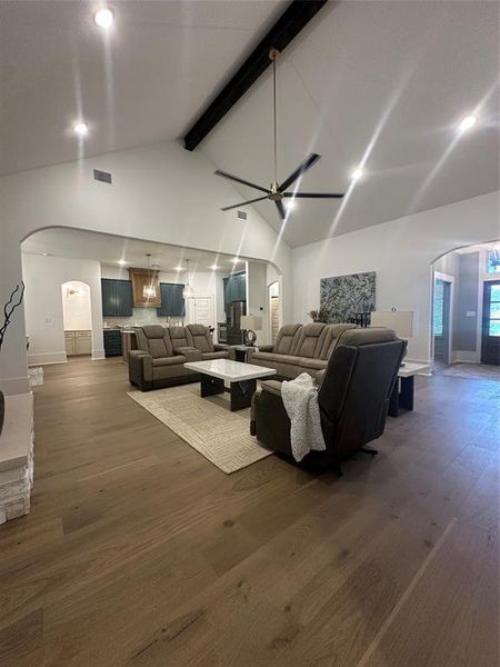 Vaulted ceiling with exposed wood beam and modern ceiling fan