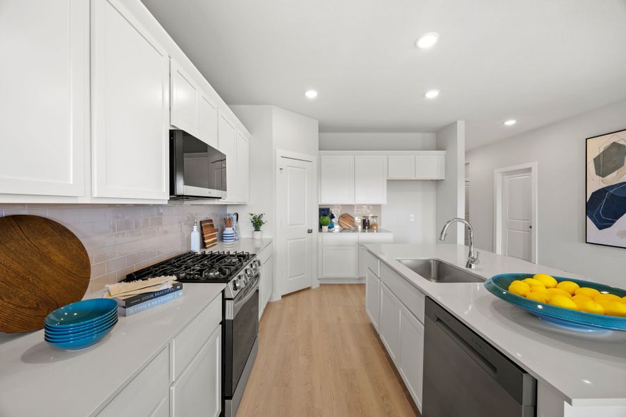 A kitchen with white cabinets. A kitchen with white cabinets.
