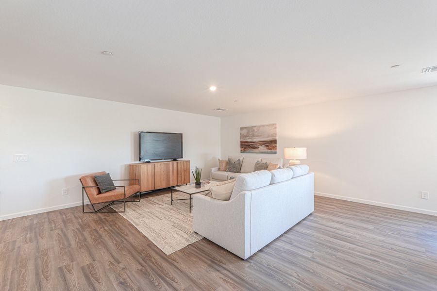 A living room with a large television. A living room with a large television.