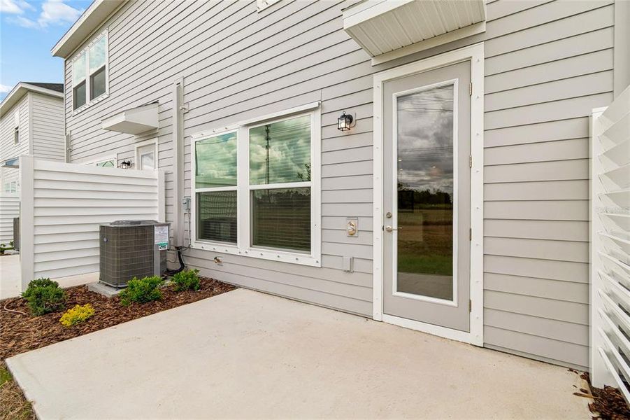 Exterior details and patio area of a home in Waterset Townhomes, Apollo Beach (Image 3).