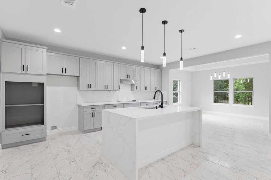 Open room to the right is the dining room.