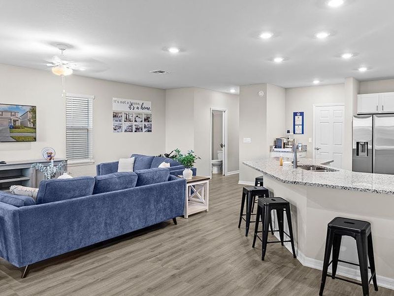 Downstairs, enjoy a fully open living area with luxury vinyl plank flooring.