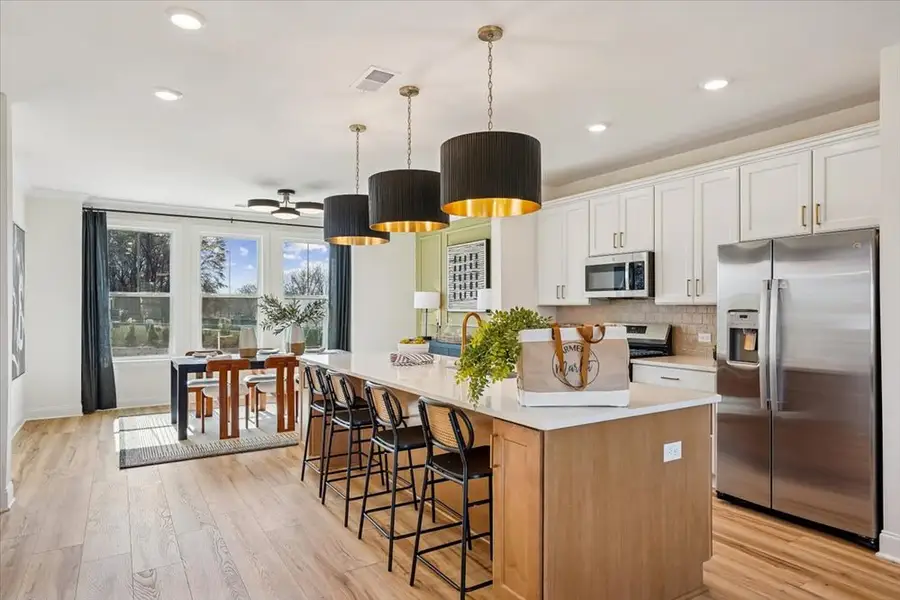 Representative furnished interior of a home built from the Yadkin by Caruso Homes in Midtown Rows, Fuquay Varina (Image 4). Representative furnished interior of a home built from the Yadkin by Caruso Homes in Midtown Rows, Fuquay Varina (Image 4).