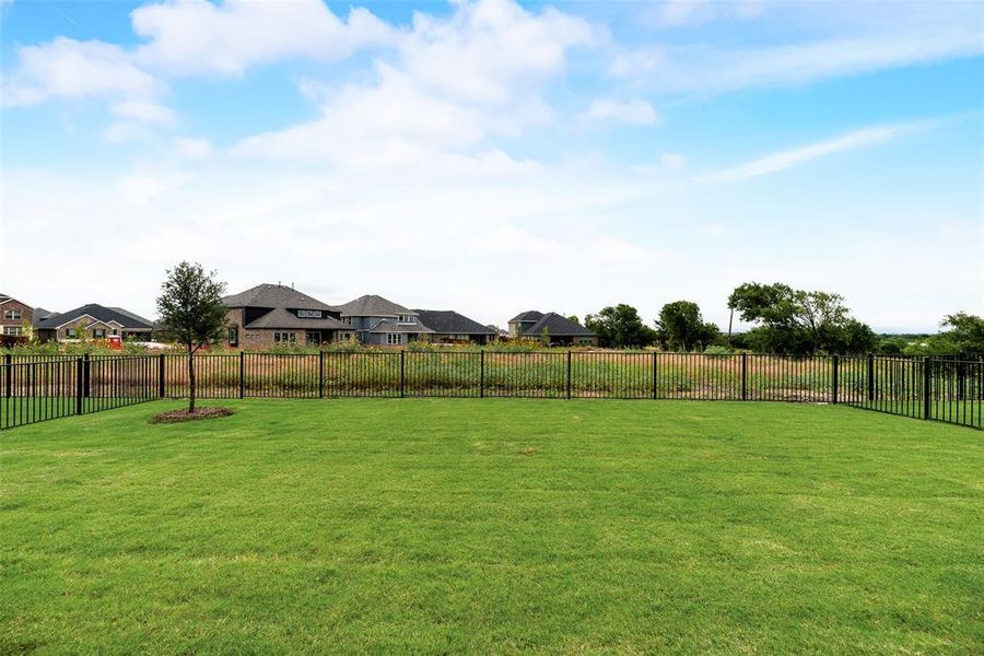 Front exterior of a new home in Valencia On The Lake, Little Elm, TX, highlighting curb appeal (Image 15).