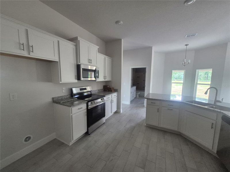 Furnished interior view inside a new home in Hill Country Estates, Dade City (Image 6).