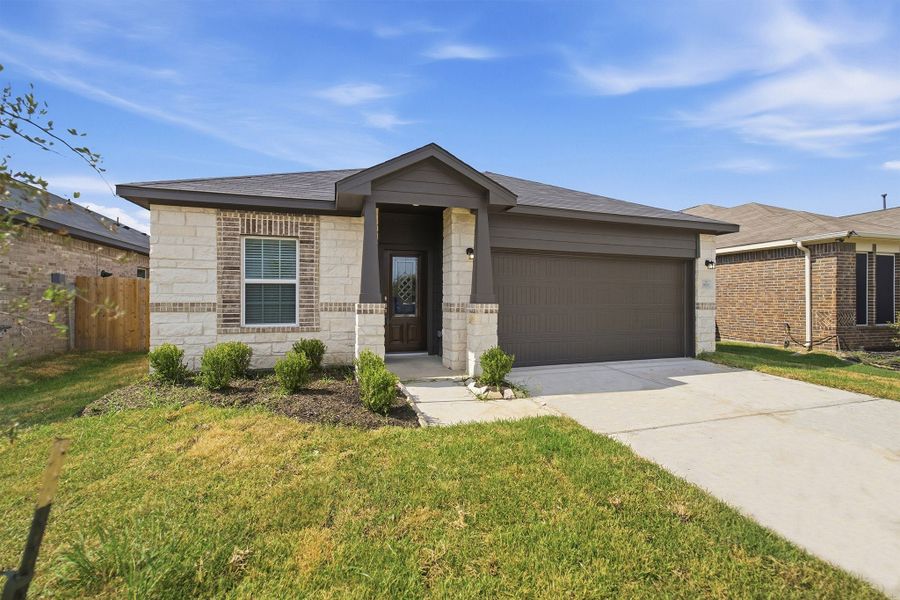 Front exterior of a new home in Pecan Estates, Crosby, TX, highlighting curb appeal (Image 2).