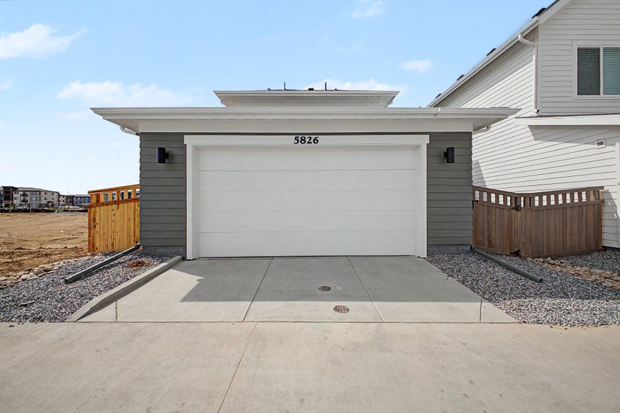 Exterior details and patio area of a home in Painted Prairie, Aurora (Image 20).