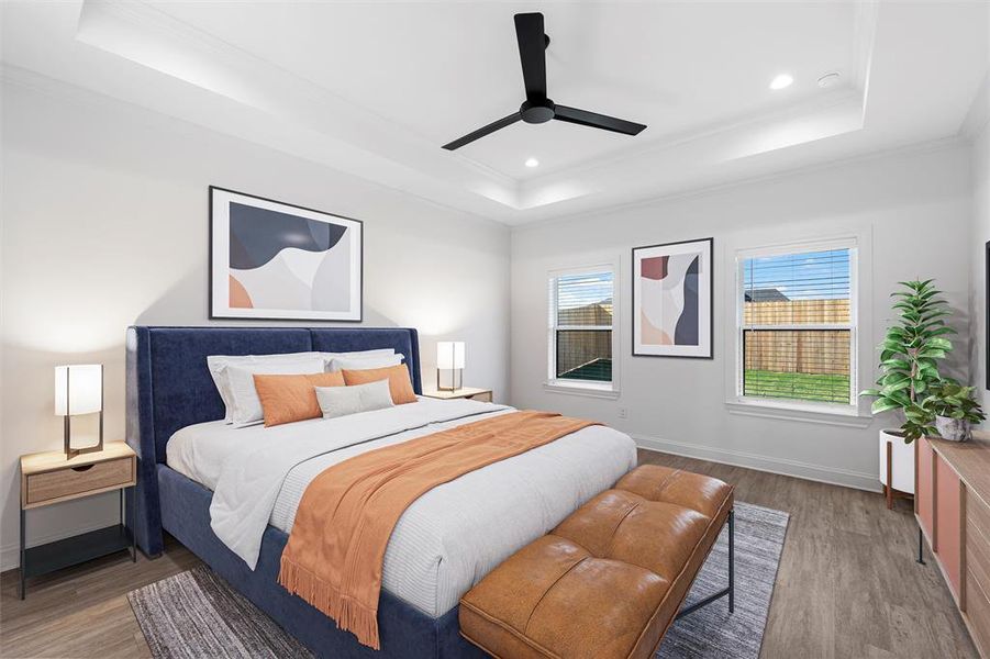 Bedroom with a tray ceiling, wood finished floors, crown molding, ceiling fan, and recessed lighting. Virtually staged Bedroom with a tray ceiling, wood finished floors, crown molding, ceiling fan, and recessed lighting. Virtually staged