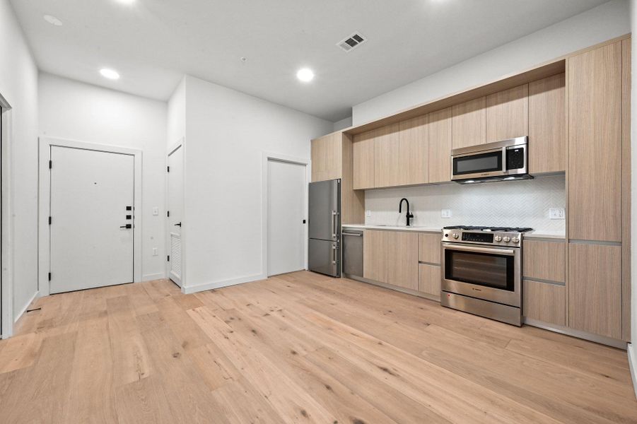 Furnished interior view inside a new home in One Oak, Austin (Image 5).