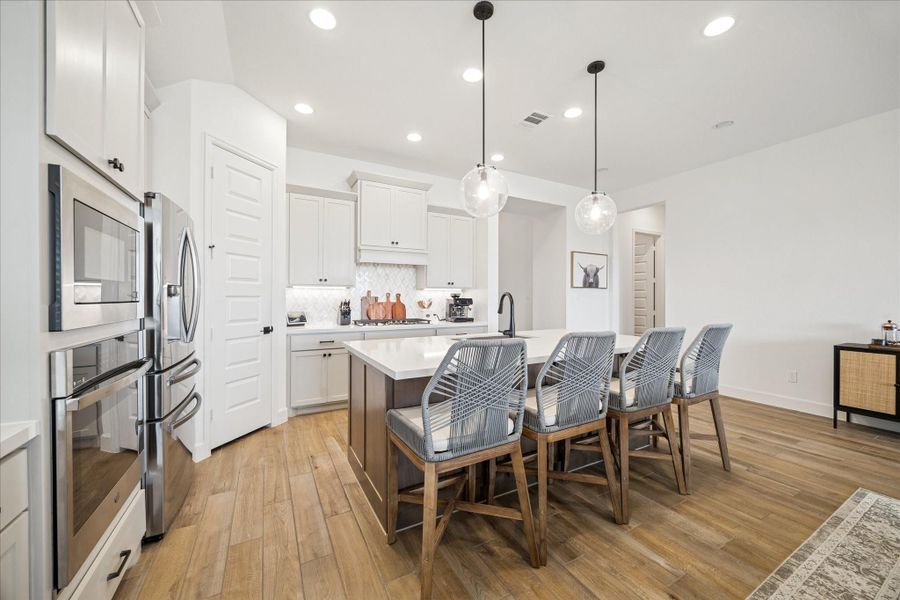 Stunning wood-like tile throughout the main living, office and kitchen areas.