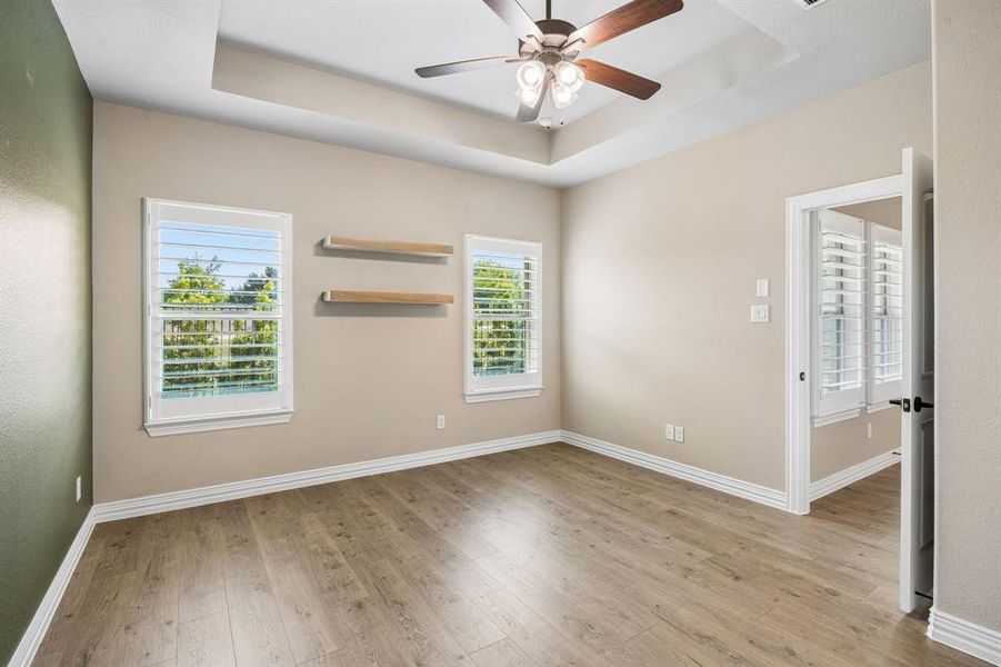 This primary suite is captivating. It has open shelving on the walls with an ensuite bath. This primary suite is captivating. It has open shelving on the walls with an ensuite bath.