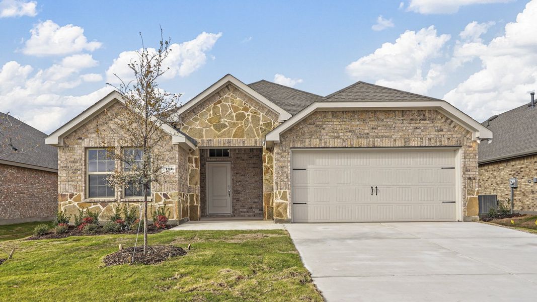 Front exterior of a new home in Trailstone, Caddo Mills, TX, highlighting curb appeal (Image 1). Front exterior of a new home in Trailstone, Caddo Mills, TX, highlighting curb appeal (Image 1).