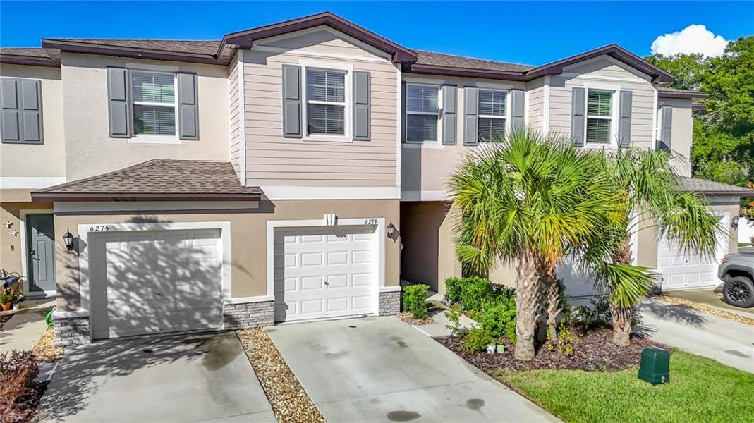 Front exterior of a new home in , Land O' Lakes, FL, highlighting curb appeal (Image 25).