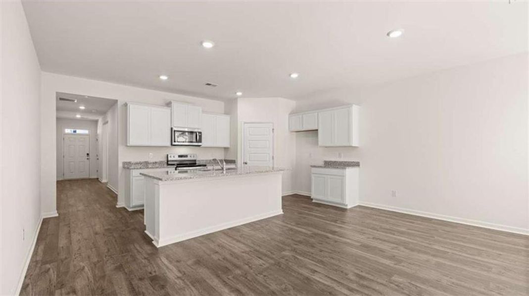 Furnished interior view inside a new home in Oakchase at Hampton, Hampton (Image 11).