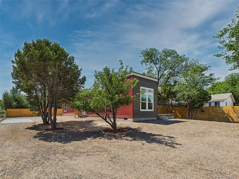 Front exterior of a new home in , Pueblo West, CO, highlighting curb appeal (Image 27).