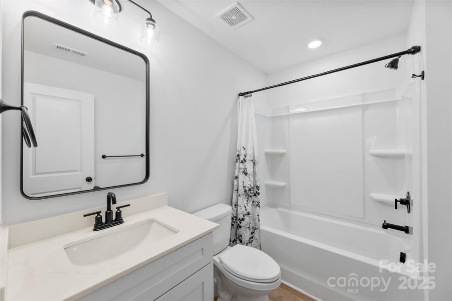 Furnished interior view inside a new home in Surrey Woods, Charlotte (Image 7).