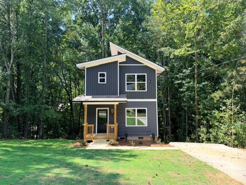 Front exterior of a new home in , Dallas, GA, highlighting curb appeal (Image 1). Front exterior of a new home in , Dallas, GA, highlighting curb appeal (Image 1).