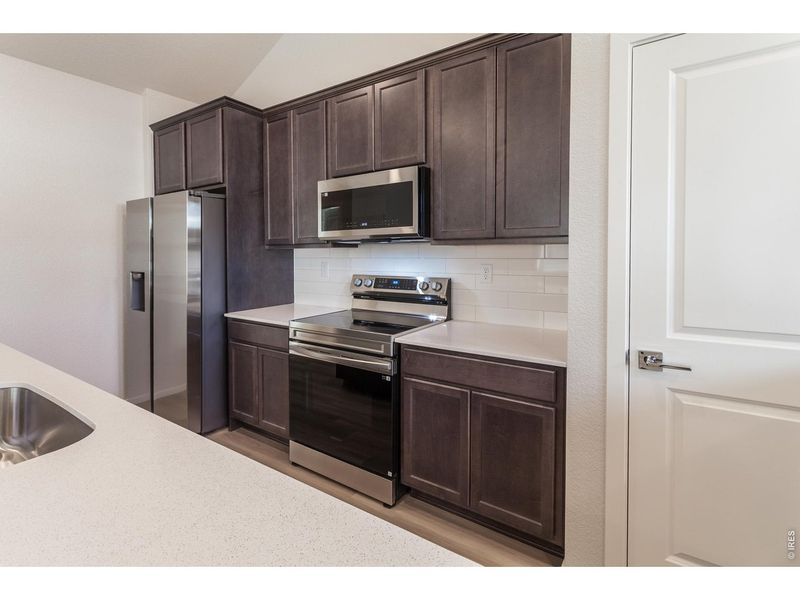 Furnished interior view inside a new home in Raindance Condos, Windsor (Image 5).