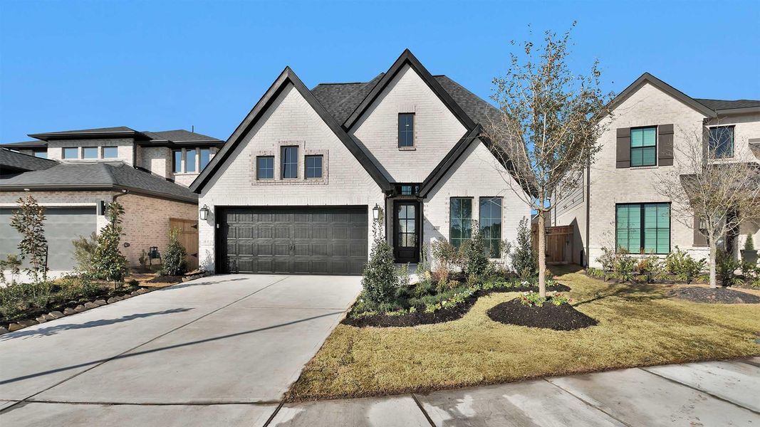 Front exterior of a new home in The Grand Prairie, Hockley, TX, highlighting curb appeal (Image 2).