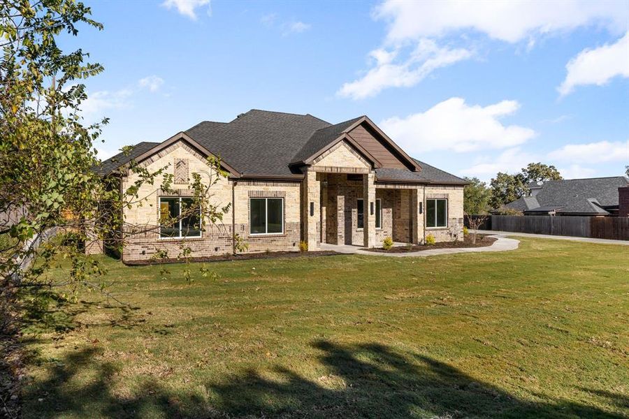 View of front of property with a front yard