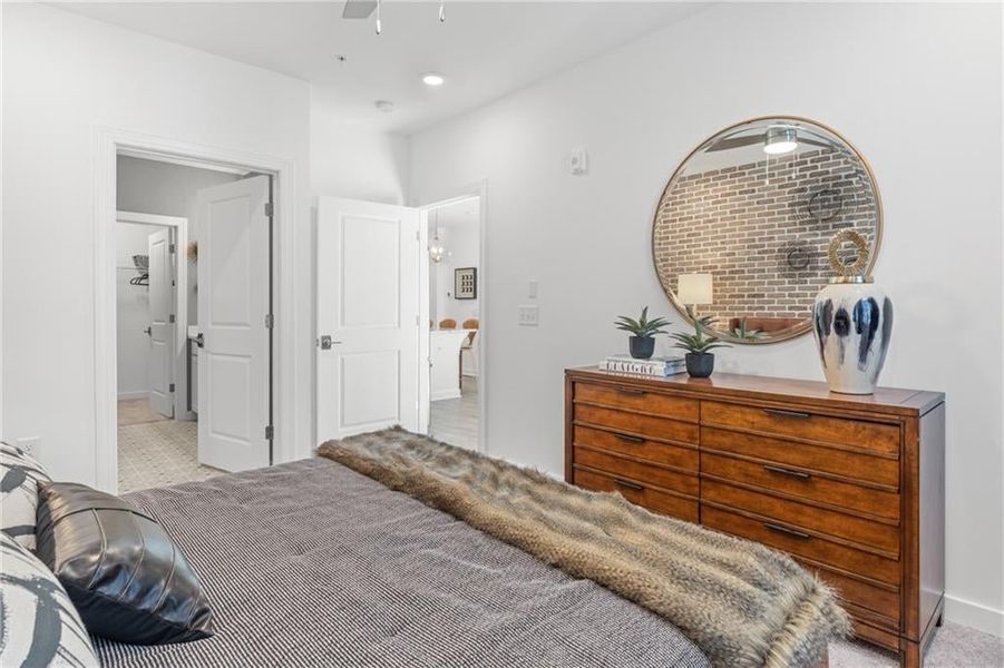 Primary bathroom is accessible from the primary bedroom.*Images from the model home. Not subject unit*