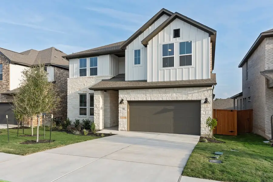 Front exterior of a new home in Park Collection at Lariat, Liberty Hill, TX, highlighting curb appeal (Image 2). Front exterior of a new home in Park Collection at Lariat, Liberty Hill, TX, highlighting curb appeal (Image 2).