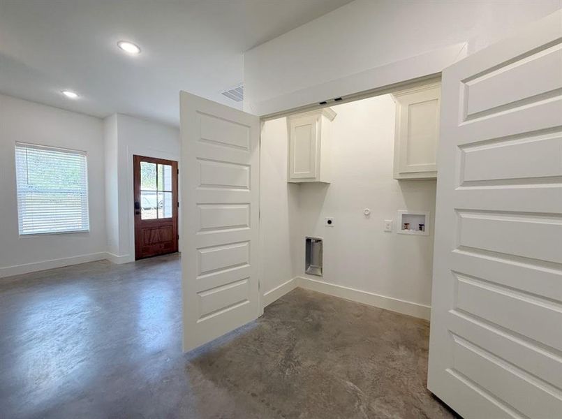Laundry room with gas dryer hookup, cabinet space, recessed lighting, hookup for a washing machine, and electric dryer hookup Laundry room with gas dryer hookup, cabinet space, recessed lighting, hookup for a washing machine, and electric dryer hookup