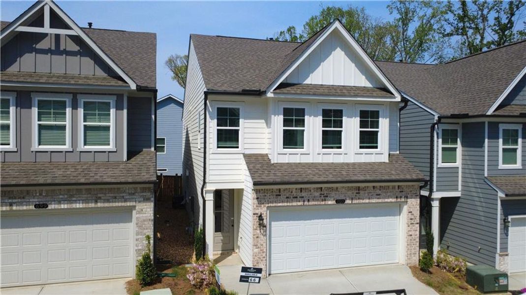 Front exterior of a new home in The Village at Shallowford, Kennesaw, GA, highlighting curb appeal (Image 18). Front exterior of a new home in The Village at Shallowford, Kennesaw, GA, highlighting curb appeal (Image 18).