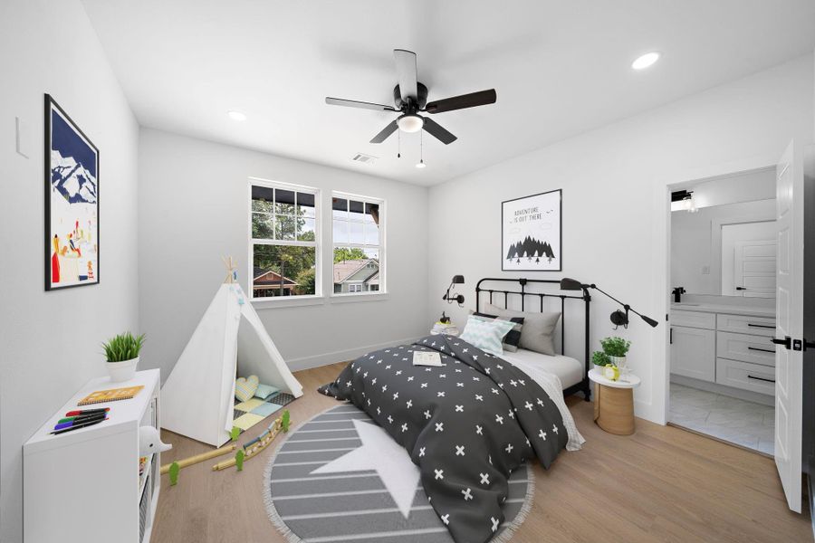 Staged photo of secondary bedroom. This bright, modern bedroom features large windows, a ceiling fan, and LVP floors. Staged photo of secondary bedroom. This bright, modern bedroom features large windows, a ceiling fan, and LVP floors.