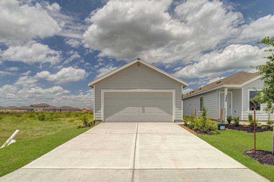 Front exterior of a new home in Santa Fe Village, Cleveland, TX, highlighting curb appeal (Image 20).
