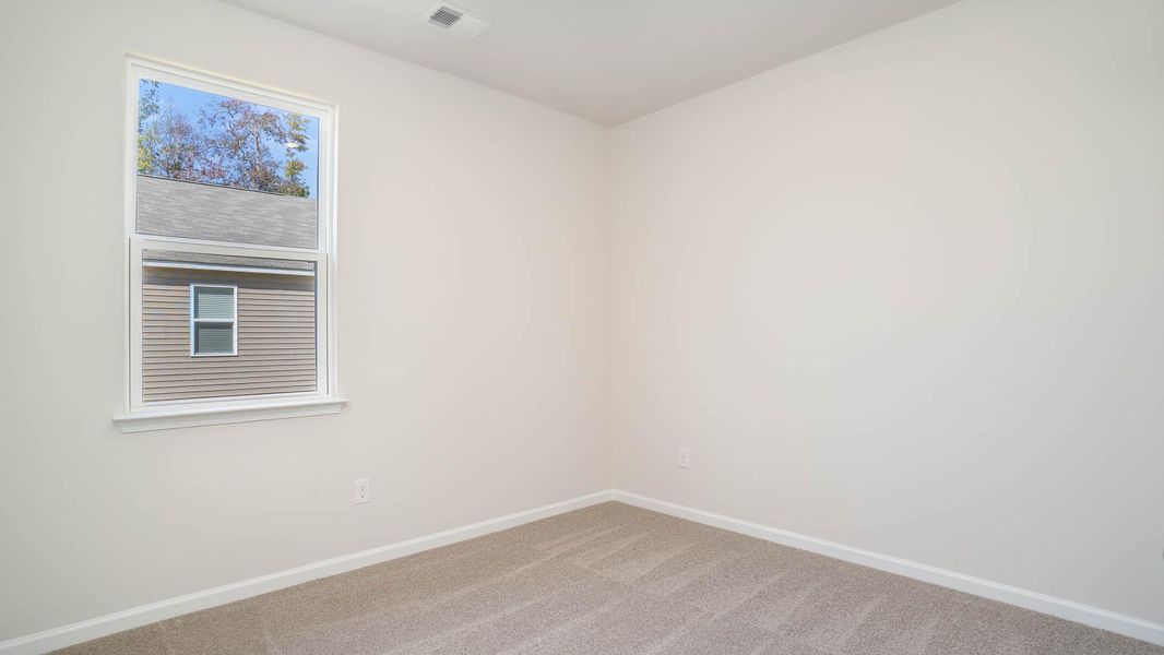 Representative unfurnished interior of a home built from the KERRY by D.R. Horton in Sandridge Park, Little River (Image 12).