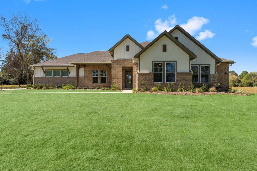 Front exterior of a new home in Homestead Hill, New Waverly, TX, highlighting curb appeal (Image 21).
