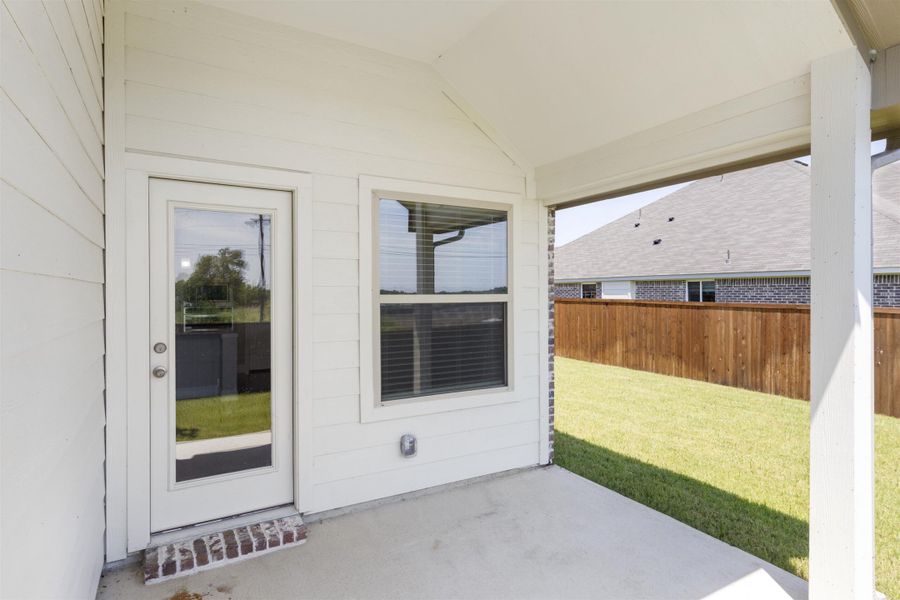 Exterior details and patio area of a home in Keeneland, Aubrey (Image 3).