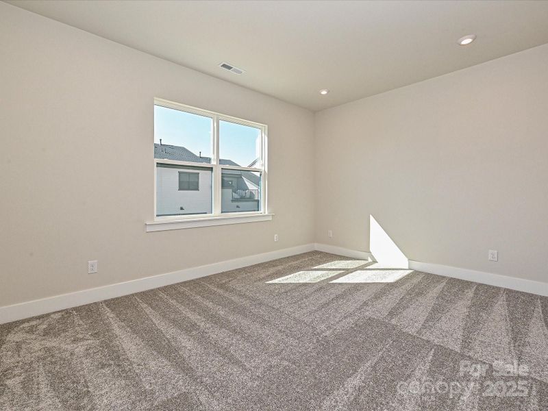 Bedroom 3 with 9' ceilings to open up the space.