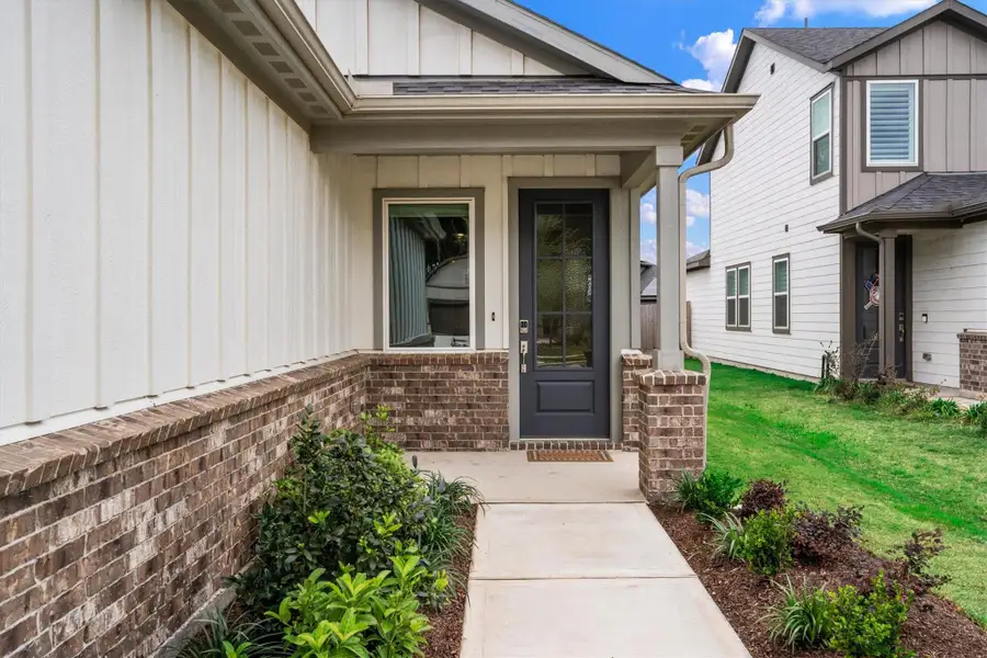Exterior details and patio area of a home in Mason Woods, Cypress (Image 3).