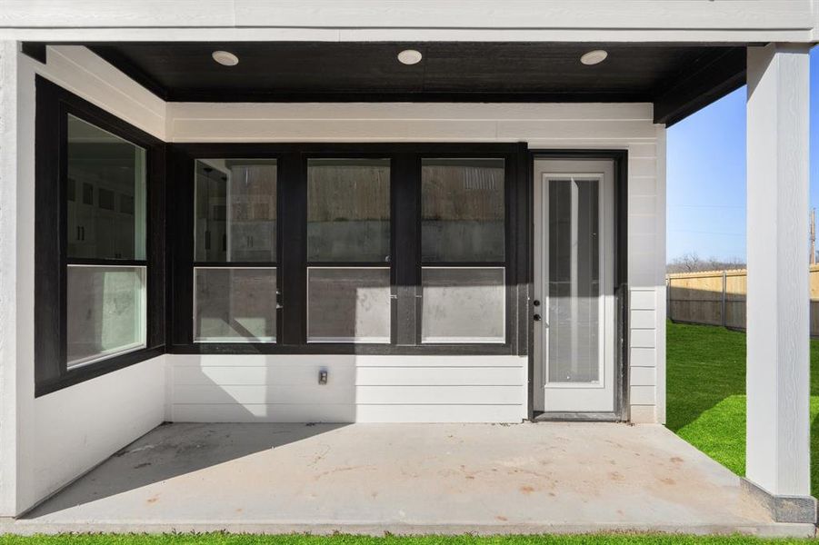 Property entrance with a patio