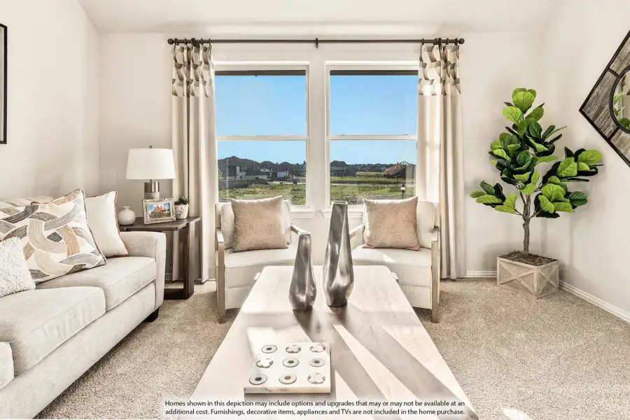 Living room with neutral sofa, two accent chairs, large windows, and carpeted floors