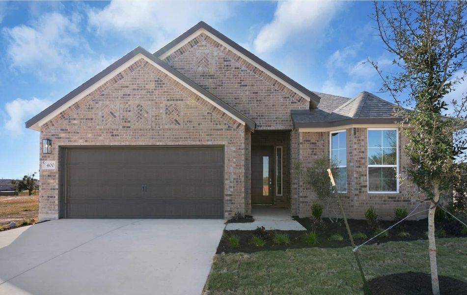 Front exterior of a new home in Nolina, Georgetown, TX, highlighting curb appeal (Image 2). Front exterior of a new home in Nolina, Georgetown, TX, highlighting curb appeal (Image 2).