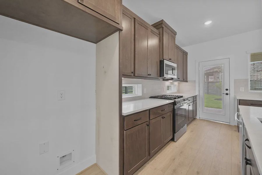 Furnished interior view inside a new home in Bridgeland Courtyard, Cypress (Image 8).