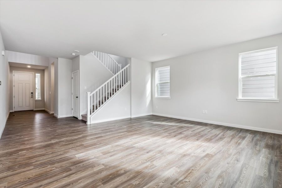 A room with a wood floor and a wood floor.
