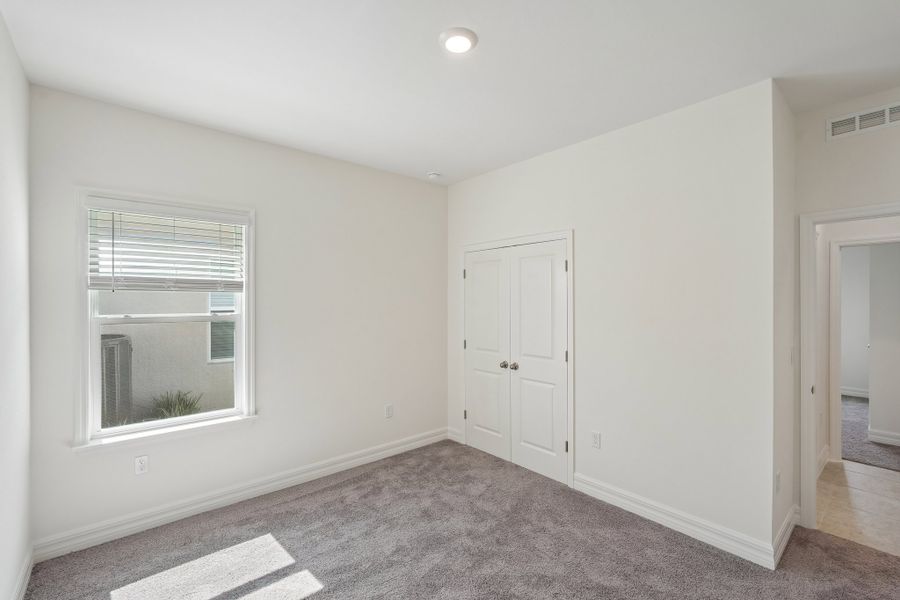 Spacious, unfurnished interior of a new home in Heritage Station, Punta Gorda (Image 56).