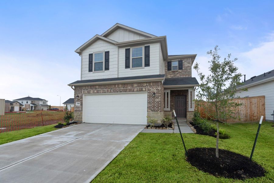 Front exterior of a new home in Crosby Farms, Crosby, TX, highlighting curb appeal (Image 2). Front exterior of a new home in Crosby Farms, Crosby, TX, highlighting curb appeal (Image 2).
